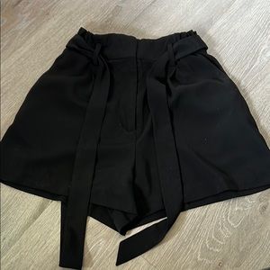 Black dress shorts.